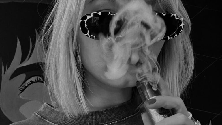 Woman vaping.