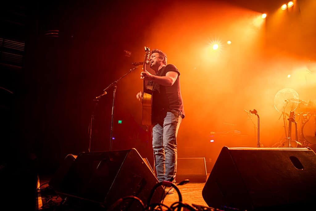 Travis Collins pictured on stage performing at The Enmore Theatre in Sydney on Sep 03, 2023 (Image: Chris Neave)